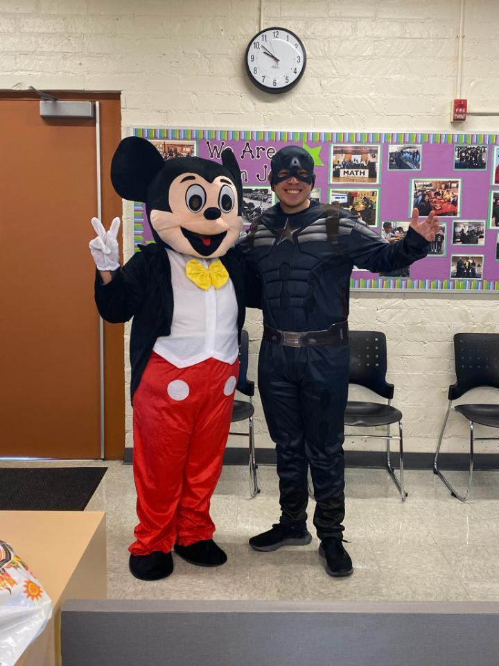 Staff dressed up as mickey mouse and captain america